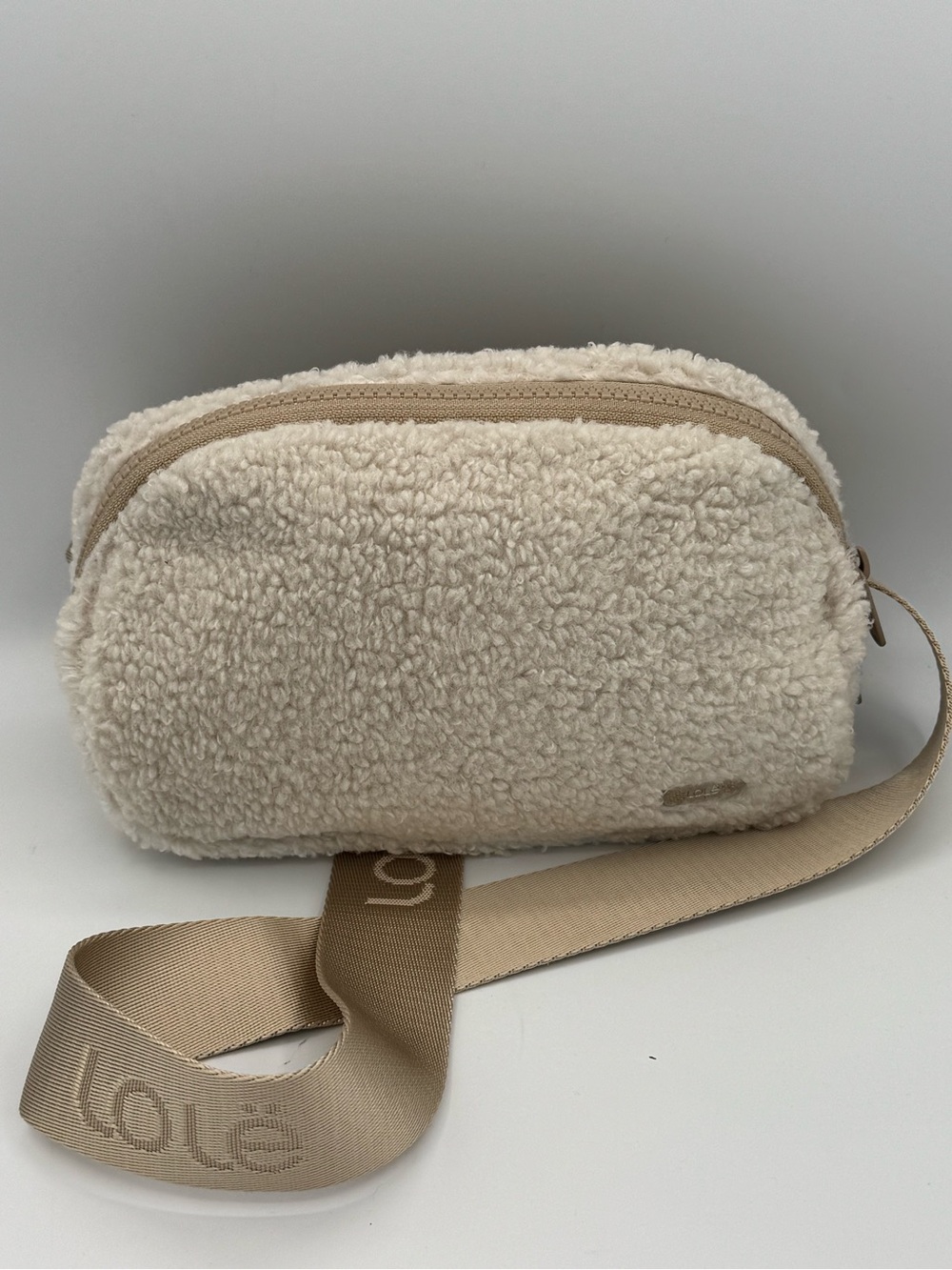 Lole Beige Sherpa Crossbody Belt Bag with Logo Embossed Branded Adjustable Strap
